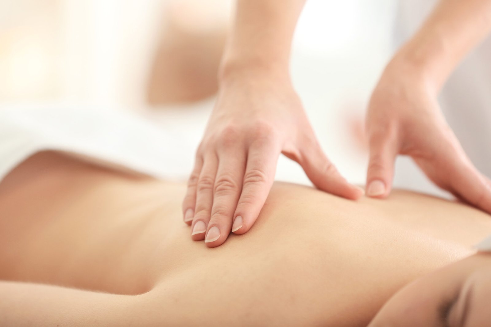 Young woman having massage in spa salon